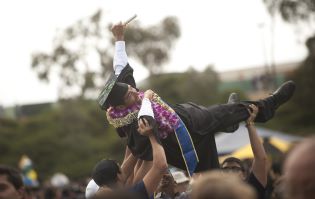 Student-crowd-surfs-with-family-following-graduation-hr.jpg
